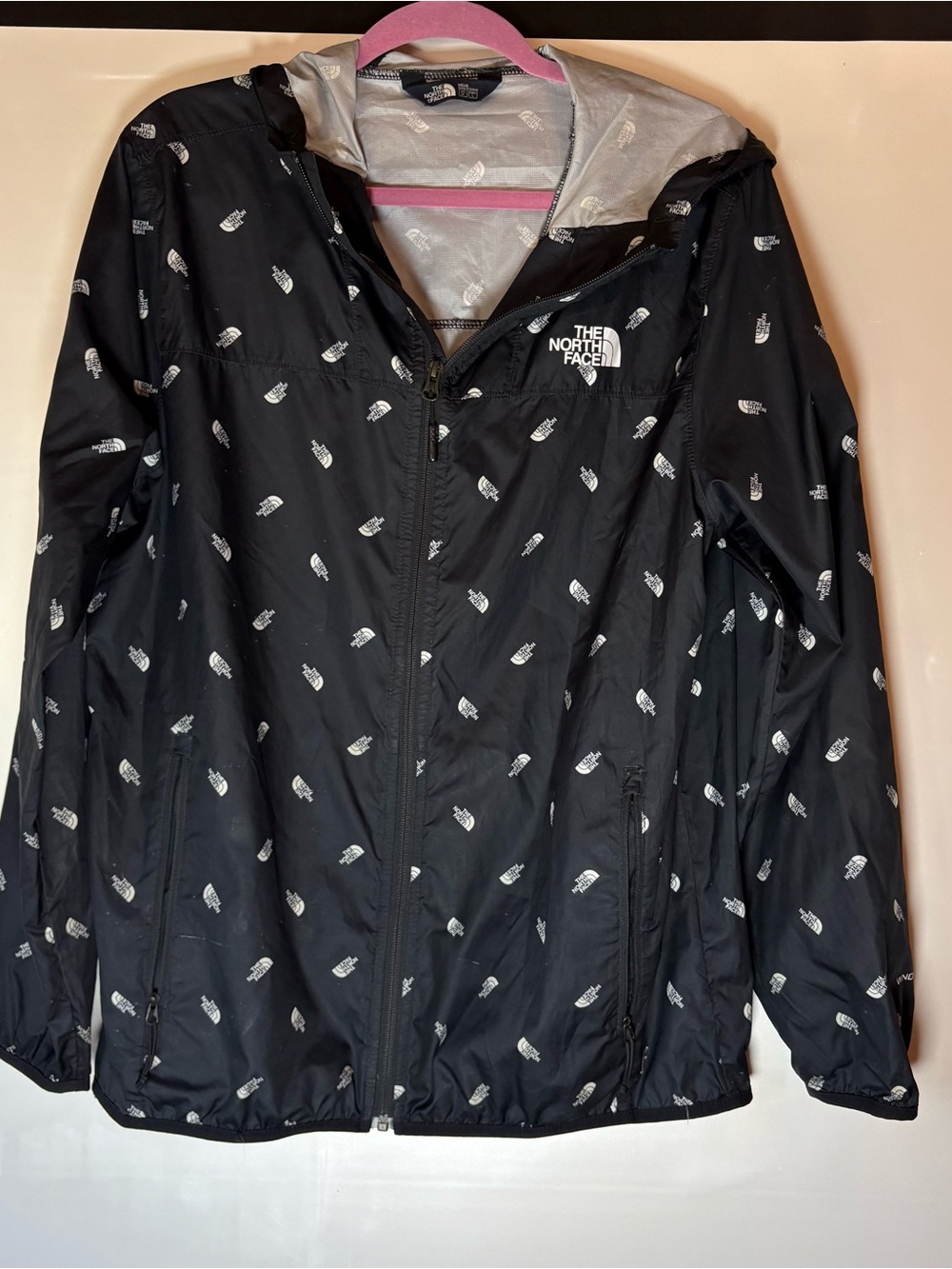 The North Face Black Hooded Rain Jacket with Allover Logo Print Windwall style